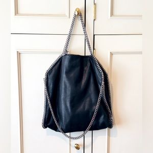 Black Chain Handbag. It also has a pouch inside. Lined in Peach Satin. NWOT